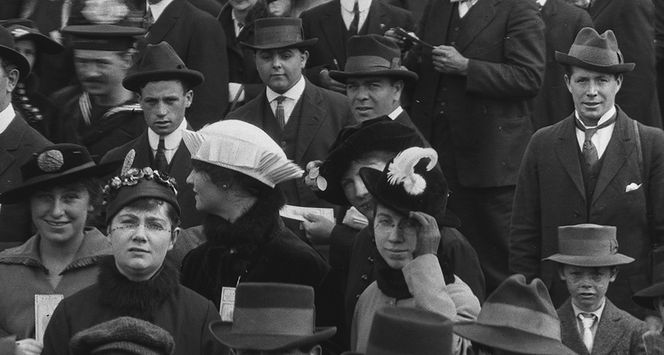 Women in hats in crowd.