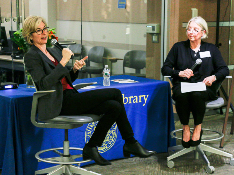 Jennifer Doudna, left, professor and co-inventor of CRISPR-Cas9 gene editing, speaks with Susan Koskinen, head of the Life and Health Sciences Library Division, at the Bioscience & Natural Resources Library on Nov. 14, 2017. (Photo by J. Pierre Carrillo for the University Library)