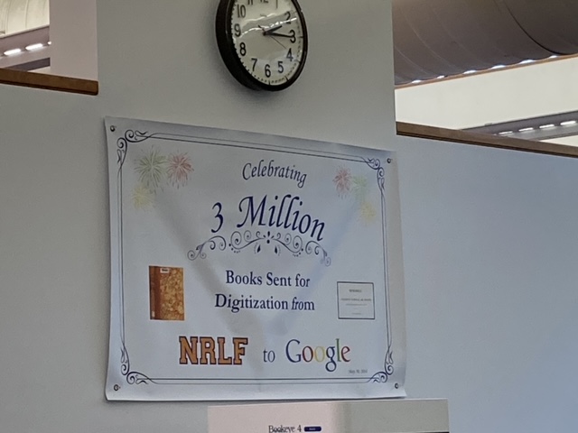 Wall banner celebrating 3 million items sent from NRLF to Google for digitization