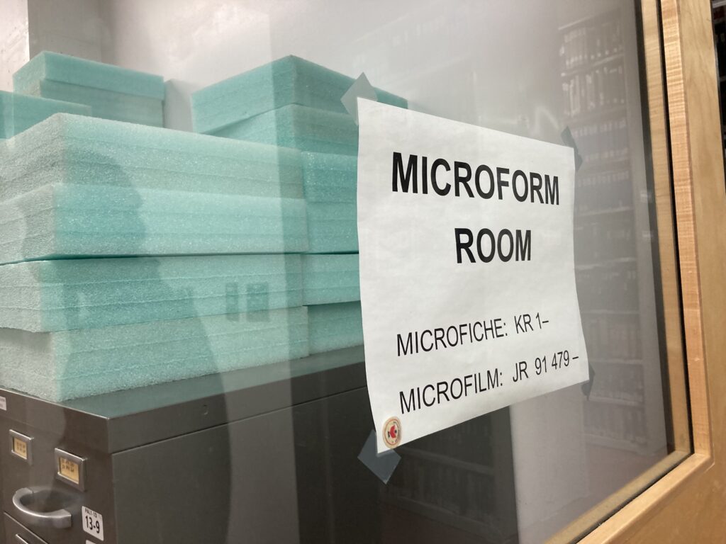 Sign on window reads "Microform Room"