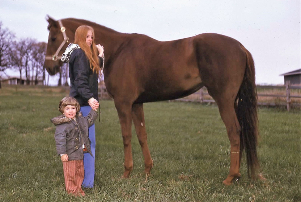 Cheryl Resh and Jeff Haigh standing next to a horse