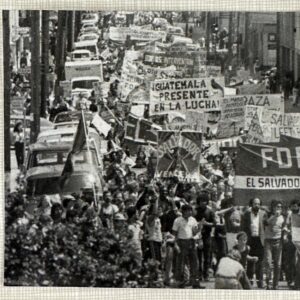 Protest photograph from the Acción Latina archive: large crowd with banners on unidentified city street