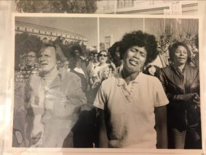 Protest photograph from the Acción Latina archive: young black woman with eyes closed