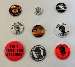 Nine buttons arranged in three rows: Newton for Congress/Seale for Assembly (Peace & Freedom Party); Abolish the Draft; Tim Peebles - A Black Man; Black Power; Dick Gregory for President; Huey for Congress; I'm a Dame for Dellums; Warren Widener for Mayor; Free Rev. Chavis and All Political Prisoners