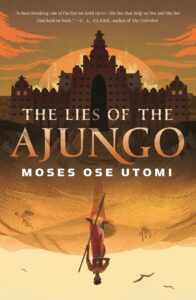 Cover in oranges emphasizing a city amid the sands with a person positioned upside down.