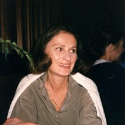 A woman smiling and seated